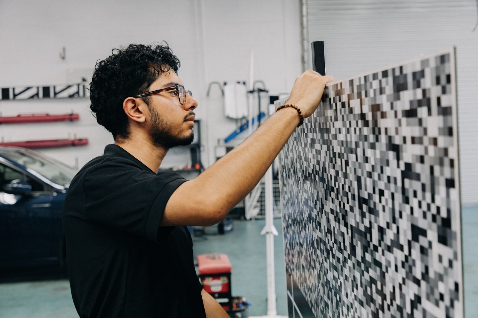 Technician positioning an ADAS calibration target board